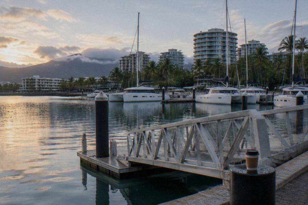 Cairns city skyline seen across the lagoon on the Esplanade in morning light